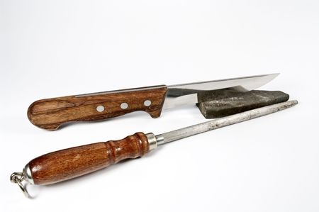 Kitchen knife and stone for sharpeningの写真素材