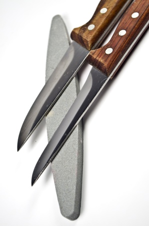 Two kitchen knife and a whetstone