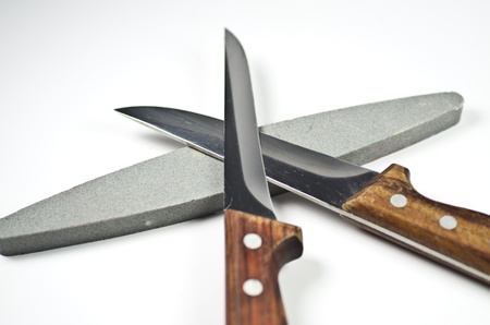 Two kitchen knife and a whetstone