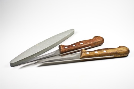Two kitchen knife and a whetstoneの写真素材