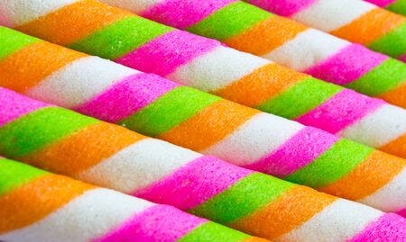 Close-up of striped wafer rolls colorful  .Background or textureの写真素材