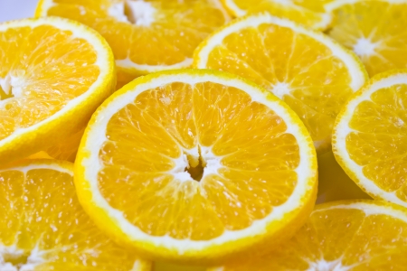 Orange fruits slices healthy food backgroundの写真素材