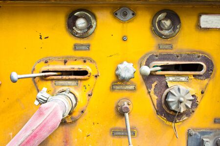 Chrome dials and valves on an old  car equipment]の写真素材