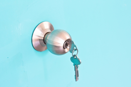 Aluminium door knob on the green backgroundの写真素材