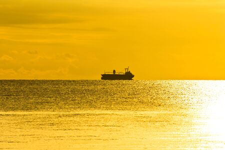 silhouette boat on the seaの写真素材