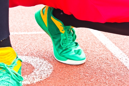 athlete at the start line of the stadiumの写真素材