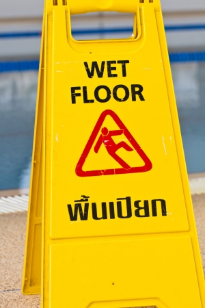 Sign advising caution on wet floorの写真素材