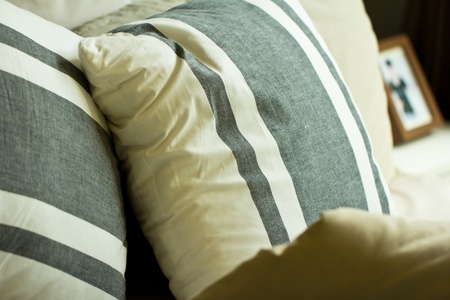 Comfortable soft pillows on the bedの写真素材