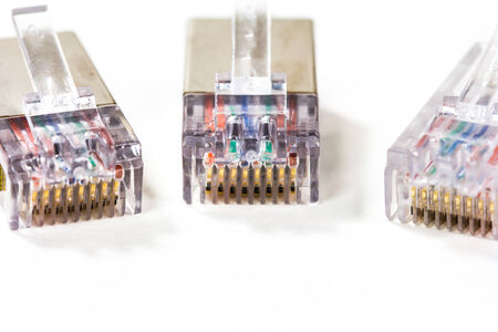 Close up computer network cables isolated on white backgroundの写真素材