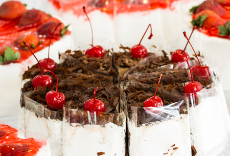 Chocolate cake with red cherriesの写真素材