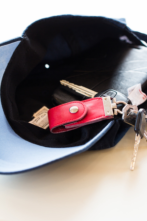 Bunch of house keys and car keys with remote on the cap