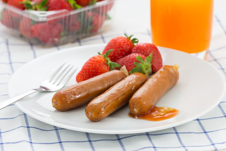 Breakfast sausage with fresh fruitの写真素材