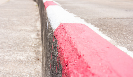 Close up red and white road barrierの写真素材