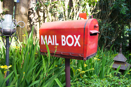 View of red mail box in the garden