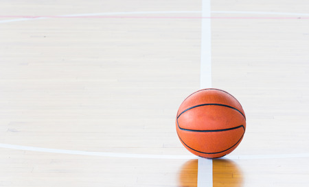Basketball ball over floor in the gymの写真素材