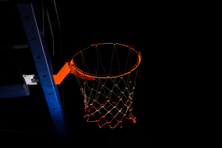 Basketball hoop on  black background with light effect