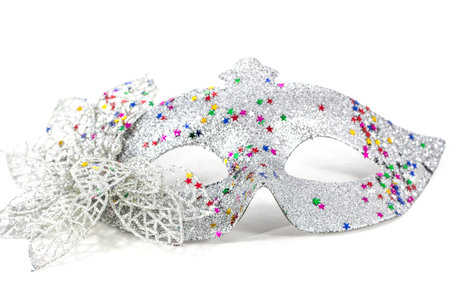 Carnival mask decorated with designs on a white backgroundの写真素材
