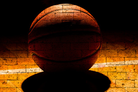 basketball court with red brick wall texture backgroundの写真素材