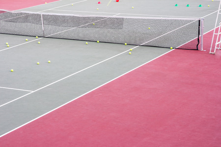 Tennis training equipment on courtの写真素材