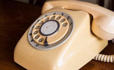 Retro pastel telephone on wooden tableの写真素材