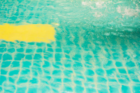 Part of swimming pool with blue waterの写真素材