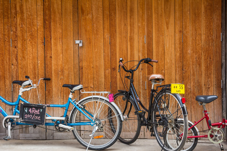 vintage bicycle on  vintage wooden house wallのeditorial素材