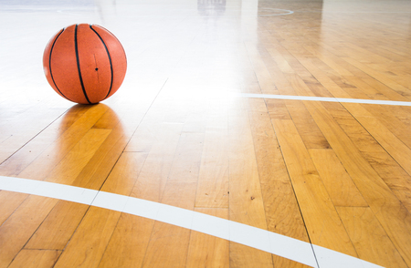 Basketball ball over floor in the gymの写真素材