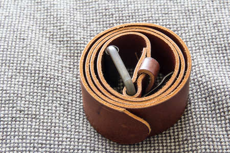 leather belt on the bedの写真素材