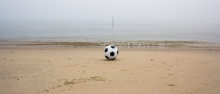 soccer ball on beachの写真素材