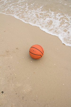 basketball ball on the beachの写真素材