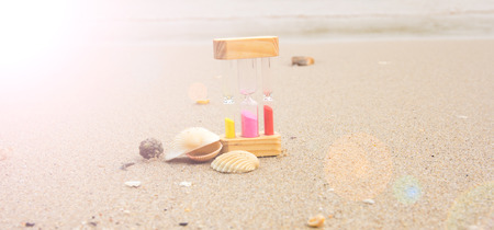 hourglass on the sand beachの写真素材