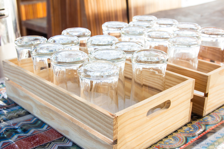 Many rows of empty glass cups on table.の写真素材