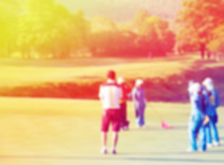 blur golf players on courseの写真素材