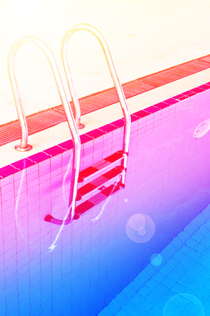 Stairs of the empty swimming pool in universityの写真素材