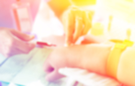 nurse pricked blood from a patientの写真素材