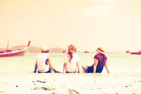 Group Of Friends At The Sand Beach With Color Filtersの写真素材