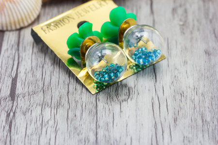 earrings on wooden backgroundの写真素材