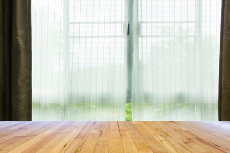 Curtain on the window with wooden floorの写真素材