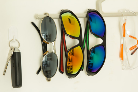 Close up fashion sunglasses on white wallの写真素材