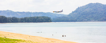 MAI KHAO BEACH,  PHUKET, THAILAND,  JANUARY- 26, 2018. airplane landing at Phuket international airportのeditorial素材