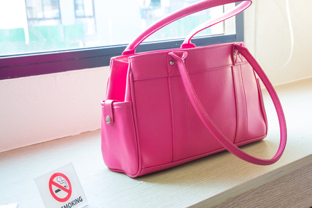 pink bag women on tableの写真素材