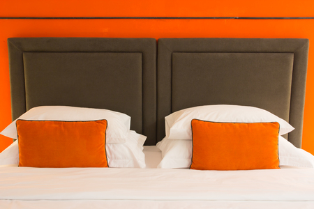 Empty modern bed in bedroomの写真素材