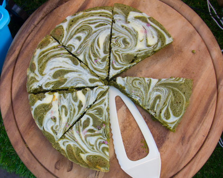 Matcha green tea brownie cake on wooden plate
