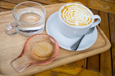 caramel latte art on tableの写真素材