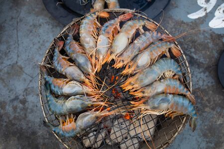Grilled shrimp on a charcoal stoveの写真素材