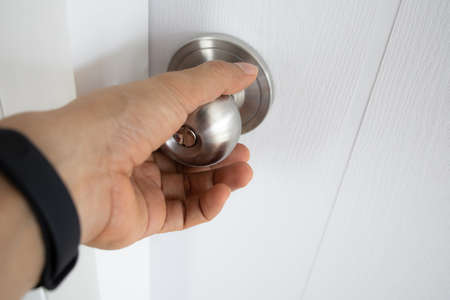 Open the door. Door with chrome metal handleの写真素材
