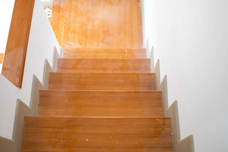 The wooden stairs are dirty. Not clean.の写真素材