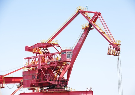 Huge construction crane against clear blue skyの写真素材