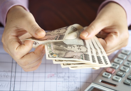 Hand counting money, Japanese currency note , Japanese yen の写真素材