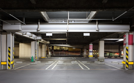 Parking garage underground interior, neon lights in darkのeditorial素材